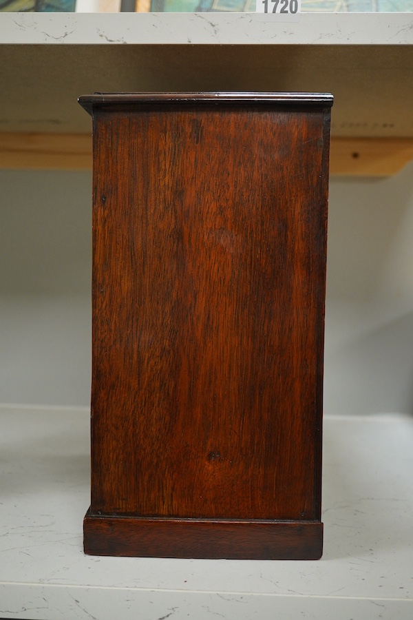 A George III style mahogany miniature chest of five drawers, 30cm high. Condition - fair/good